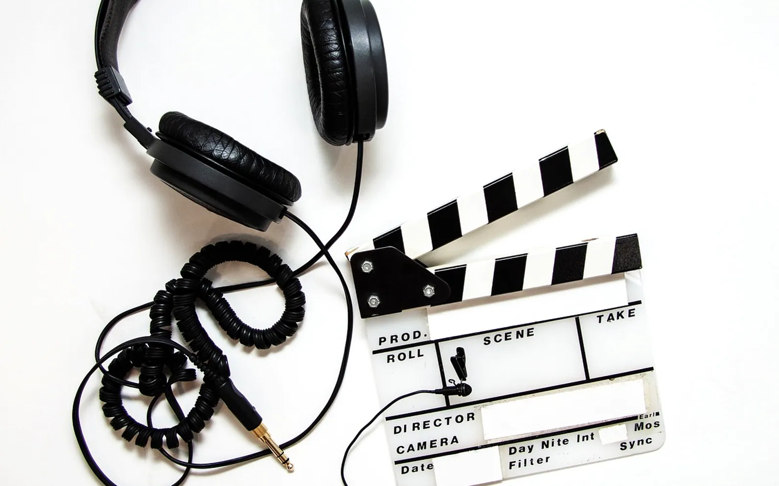 Headphones, clapper and clapperboard